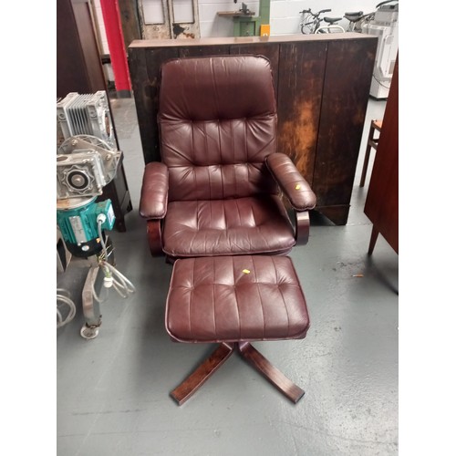 135 - A Danish Unico leatherette reclining armchair - with matching footstool