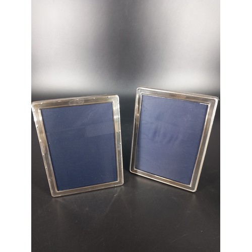 264 - Two  medium sized hallmarked silver picture frames glass sie 18x12cm