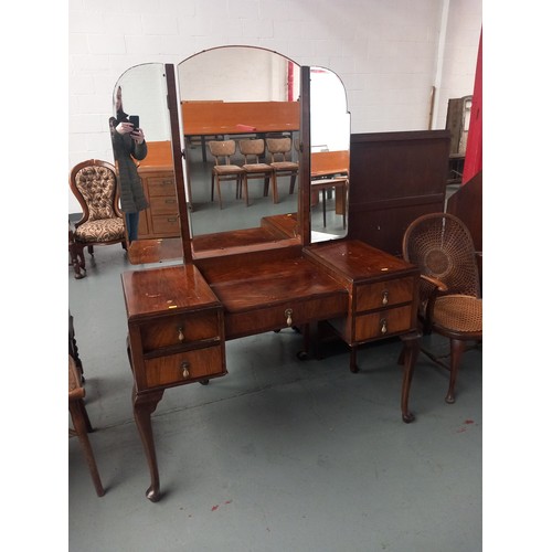 140 - A walnut triple mirror dressing table