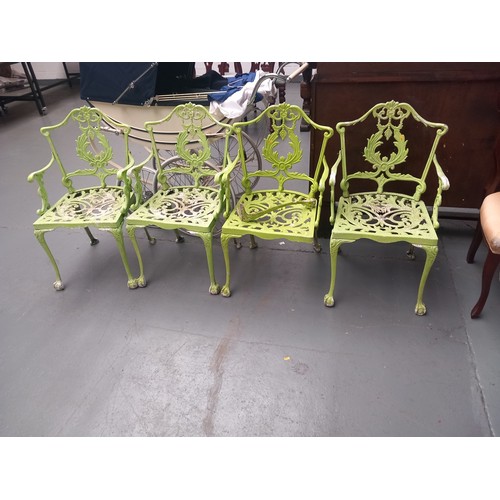 142 - Four cast iron garden chairs (one front leg needs re-attaching)