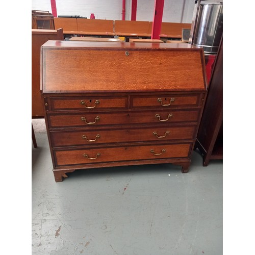 150 - An early oak bureau

Height 108cm
Width 120cm
Depth 52cm