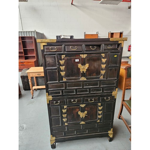 122 - A two section brass bound oriental cabinet (needs attention)

Height 152cm
Width 96cm
Depth 46cm