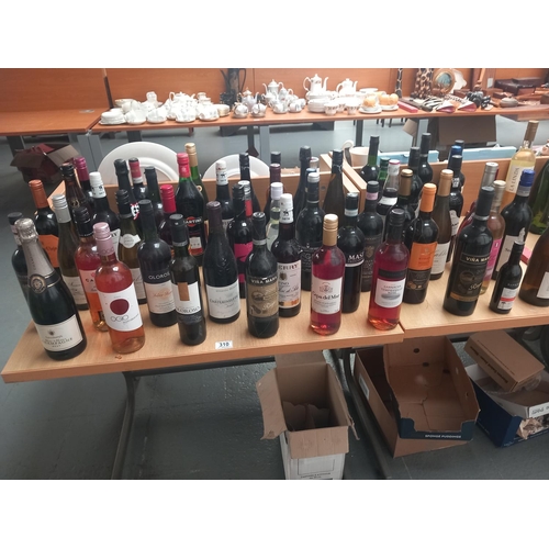 310 - A selection of alcohol to include port, champagne, red and white wine etc