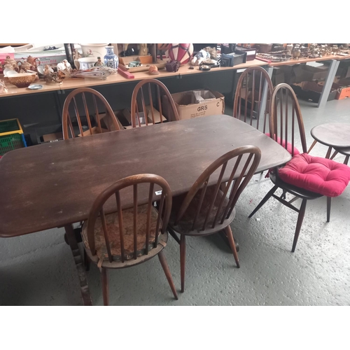 402 - An Ercol dining table and six chairs