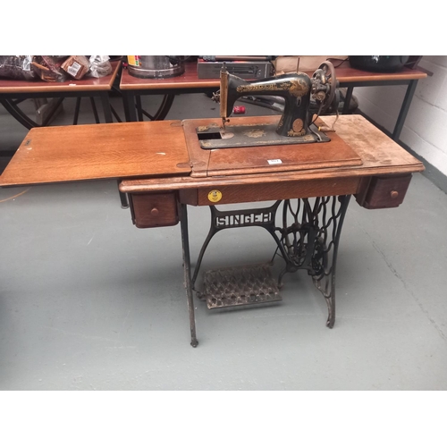 469 - A Singer Sewing machine and treadle