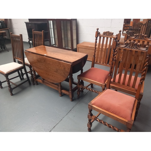 475 - An oak drop leaf dining table and five chairs