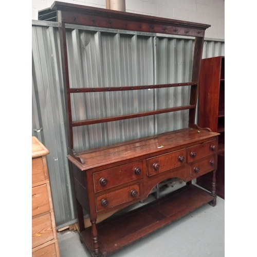 484 - An oak dresser

Height 204cm
Width 156cm
Depth 45cm