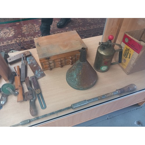 514 - Vintage tools - saws, bevel, brass sprayer, set of small drawers, antique door locks etc