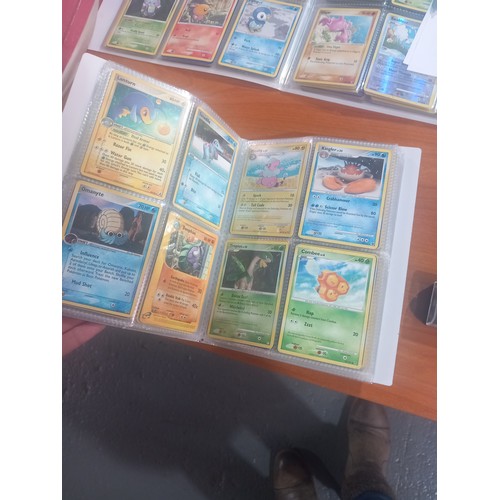 344 - Three albums of Pokémon cards - some first editions together with boxed Corgi cars, watches etc