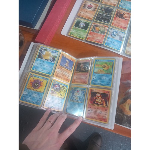 344 - Three albums of Pokémon cards - some first editions together with boxed Corgi cars, watches etc