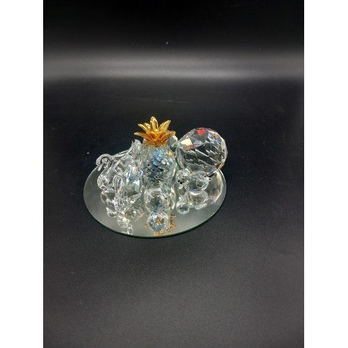 764 - A collection of small Swarovski crystal pieces - pineapple, swans etc