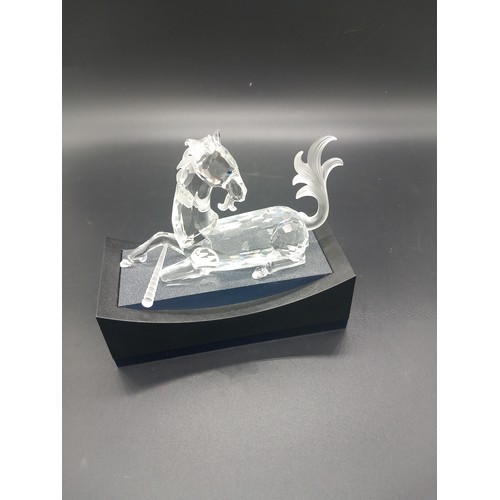 766 - A Swarovski crystal unicorn with stand