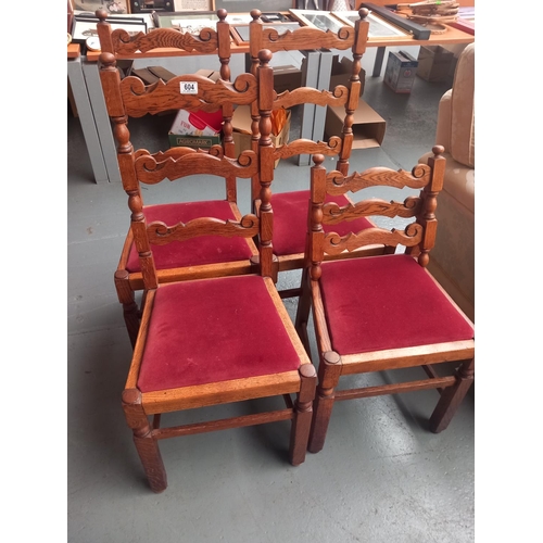 604 - Four oak dining chairs (one damaged)