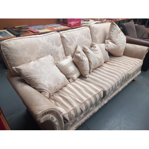 605 - An upholstered three seater sofa

Height 102cm
Width 234cm
Depth 95cm