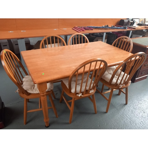 609 - A pine dining table and six chairs