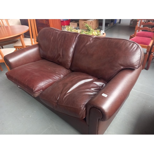 623 - A brown leatherette sofa bed

Height 86cm
Width 165cm
Depth 102cm