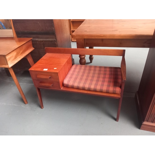 657 - A teak telephone table