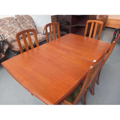 675 - A teak Meredew extending dining table and five chairs