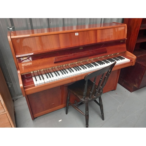 684 - A Gebr. Niendorf piano with chair