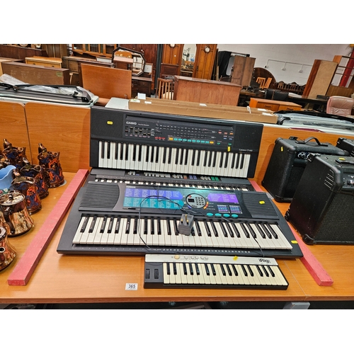 365 - 2 x Yamaha keyboards, a Casio keyboard and an iRigKeys keyboard controller - stands are located unde... 