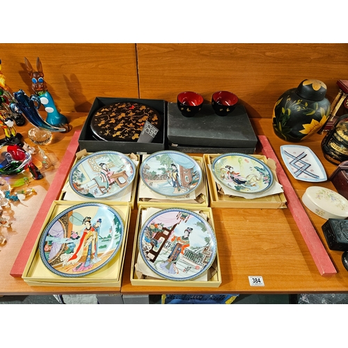 384 - Oriental style wall plates in boxes together with an oriental style bowl and a set of 5 matching bow... 