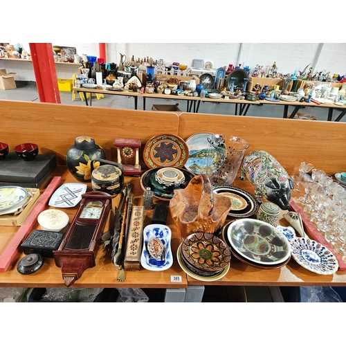 385 - Assorted china and treen to include clocks, a wooden basket, large oriental pig money box etc