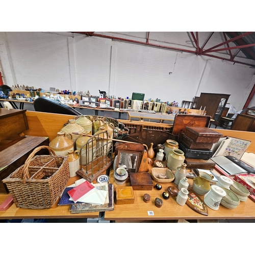 389 - A vintage lot to include stoneware bottles, a metronome, a barometer, treen, etc