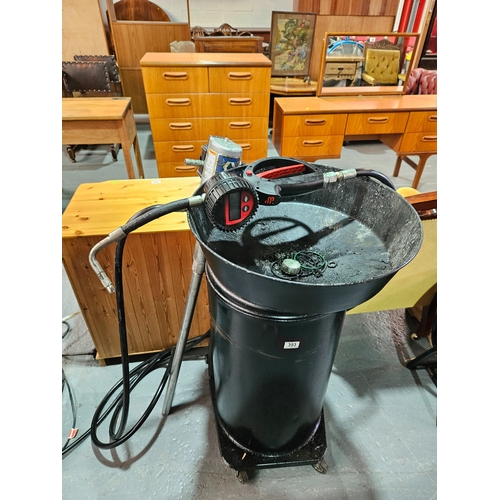 393 - An oil drum with a Graco air powered pump