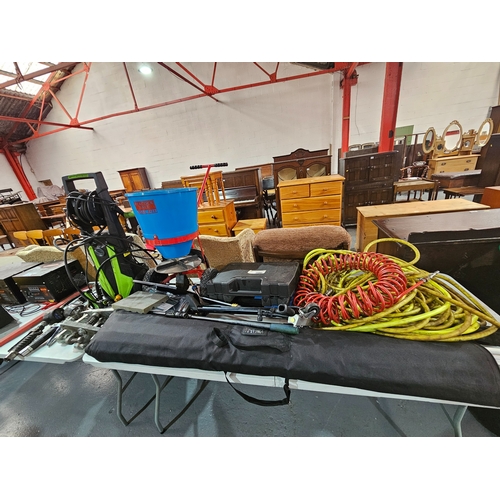 399 - A Peacock salt gritter, a Top Zone jetwash, air hoses, air guns and a pressure tester, etc