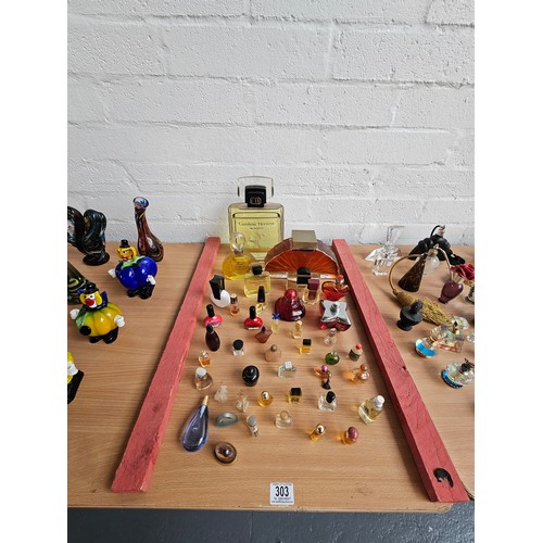 303 - Miniature perfumes and large shop display perfume bottles