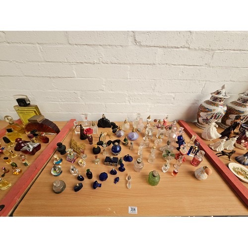 304 - A collection of scent bottles and atomisers