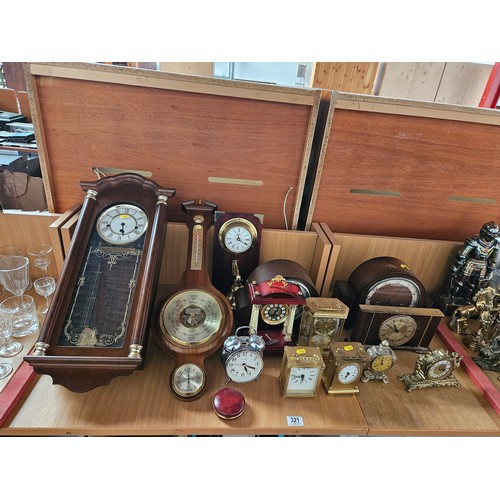 321 - Carriage clocks, mantle clocks, barometer, etc