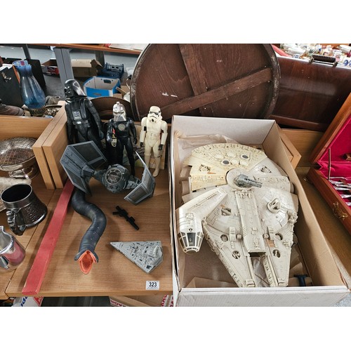 323 - A collection of Star Wars figures and a Millennium Falcon