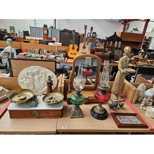 330 - 2 oil lamps, dressing table mirror, early brass and marble weighing scales, sampler, and other decor... 