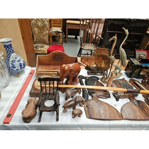 383 - Wooden items to include carved animals, barometer, model ship, African carvings, etc