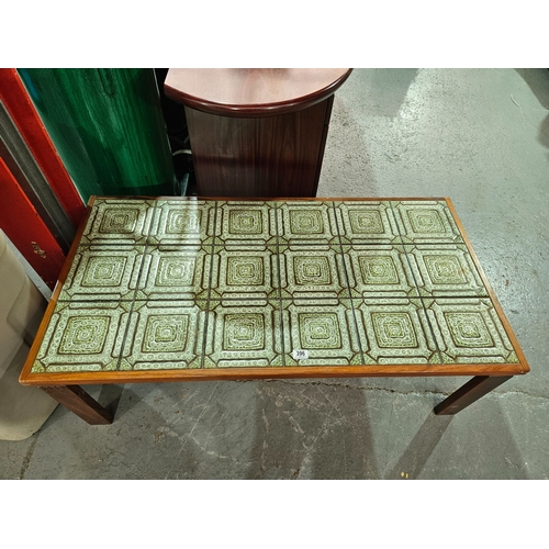 396 - A teak framed Danish Trioh tile topped coffee table

Depth 65cm, Width 126cm, Height 42cm