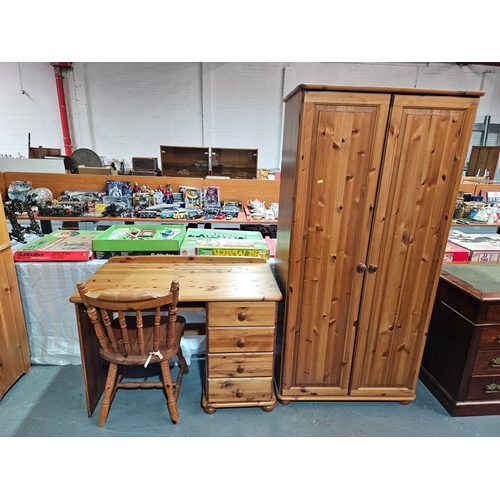 408 - A pine single pedestal desk with chair, and a pine double wardrobe 

Wardrobe measures: Width 84cm, ... 