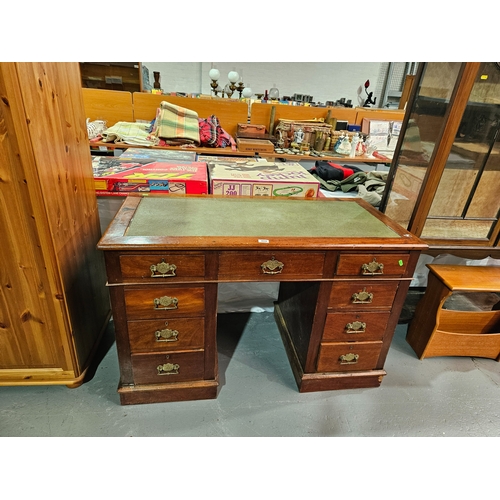 409 - A twin pedestal mahogany desk with leatherette insert

Height 78cm
Width 132cm
Depth 60cm