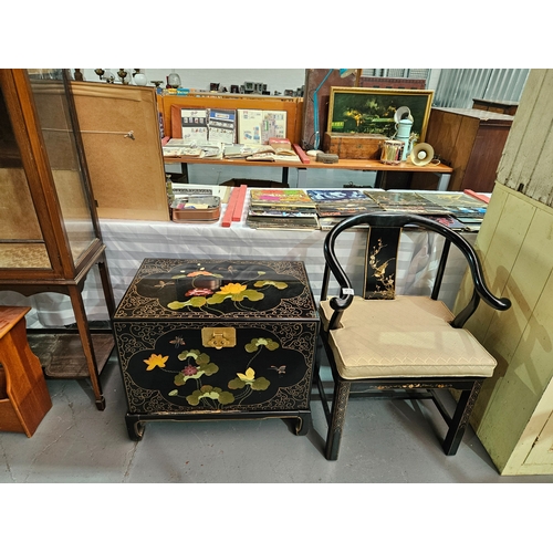 411 - A Chinese black lacquered horseshoe chair together with a Chinese black lacquered cabinet/chest on l... 