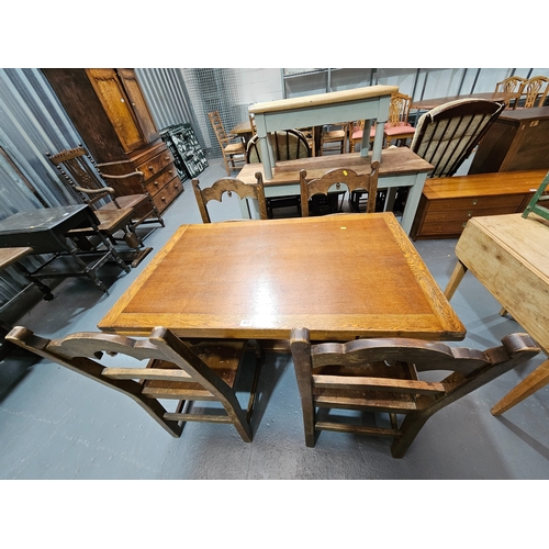 413 - An oak extending draw leaf dining table together with 4 oak chairs

Table measures: Depth 76cm, 122c... 