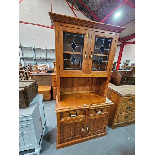 415 - A pine dresser 

Height 196cm, Width 100cm, Depth 46cm