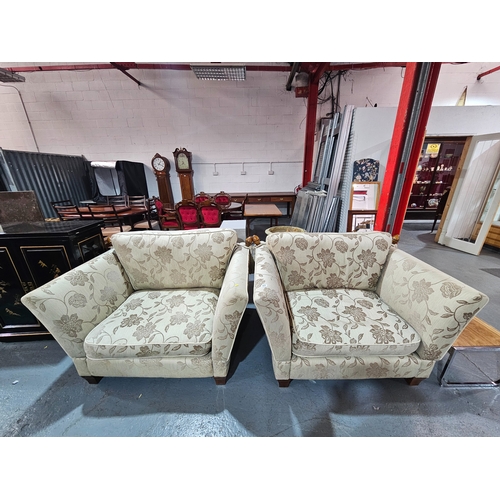 431 - A pair of upholstered Knoll snuggler drop arm sofas

Each measures: Depth 100cm, Width 108cm, Height... 