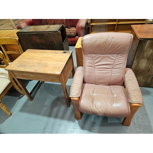 437 - A leatherette reclining armchair together with an oak desk