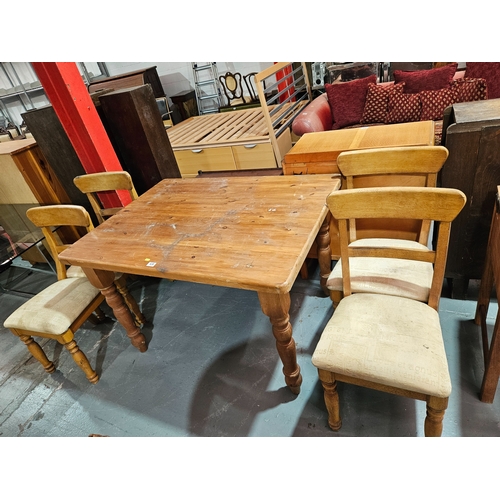 438 - A pine dining table with 4 chairs