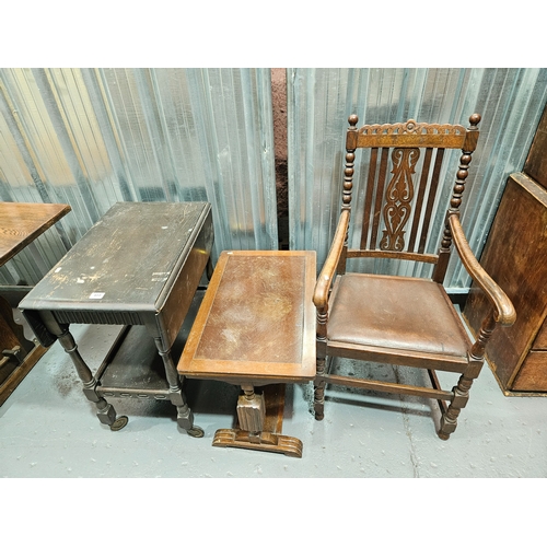 488 - An oak armchair, coffee table and a small drop leaf table