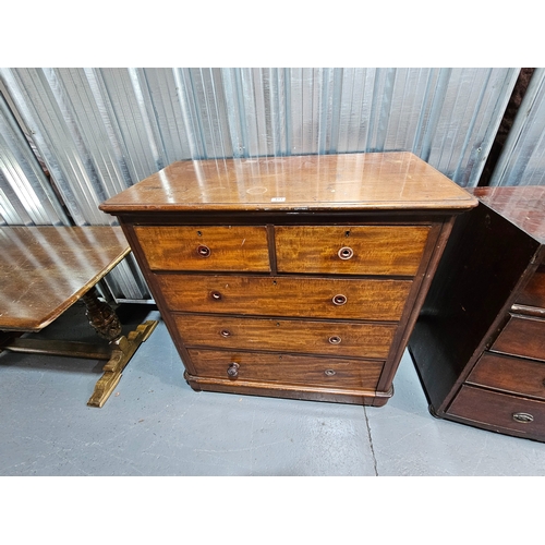 493 - A mahogany two over three chest of drawers

Height 108cm, Width 106cm, Depth 56cm