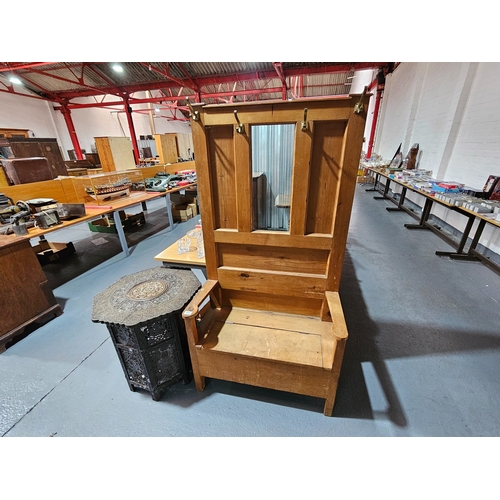 496 - A pine hallstand with seating together with a mother of pearl inlaid tourist fold out table