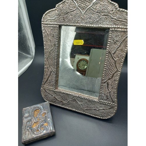 512 - A silver framed mirror - height 13 inches width 9 inches (no hallmarks but tested as silver) togethe... 