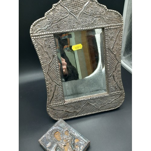 512 - A silver framed mirror - height 13 inches width 9 inches (no hallmarks but tested as silver) togethe... 