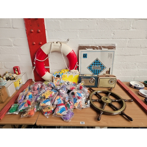 301 - 2 vintage radios, a ships wheel and life ring, wooden chessboard and a quantity of Mr Men McDonald's... 